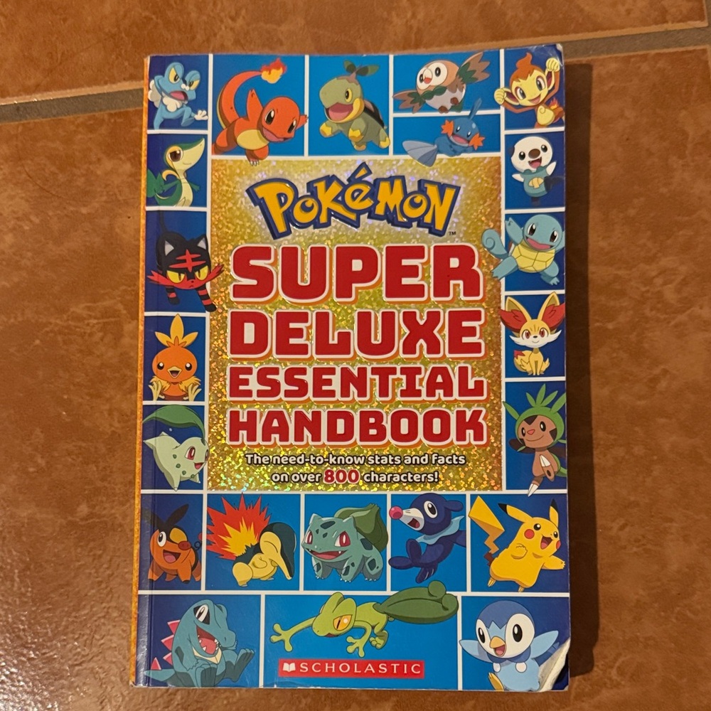 Scholastic Pokémon Handbook with Blue and Red Accents